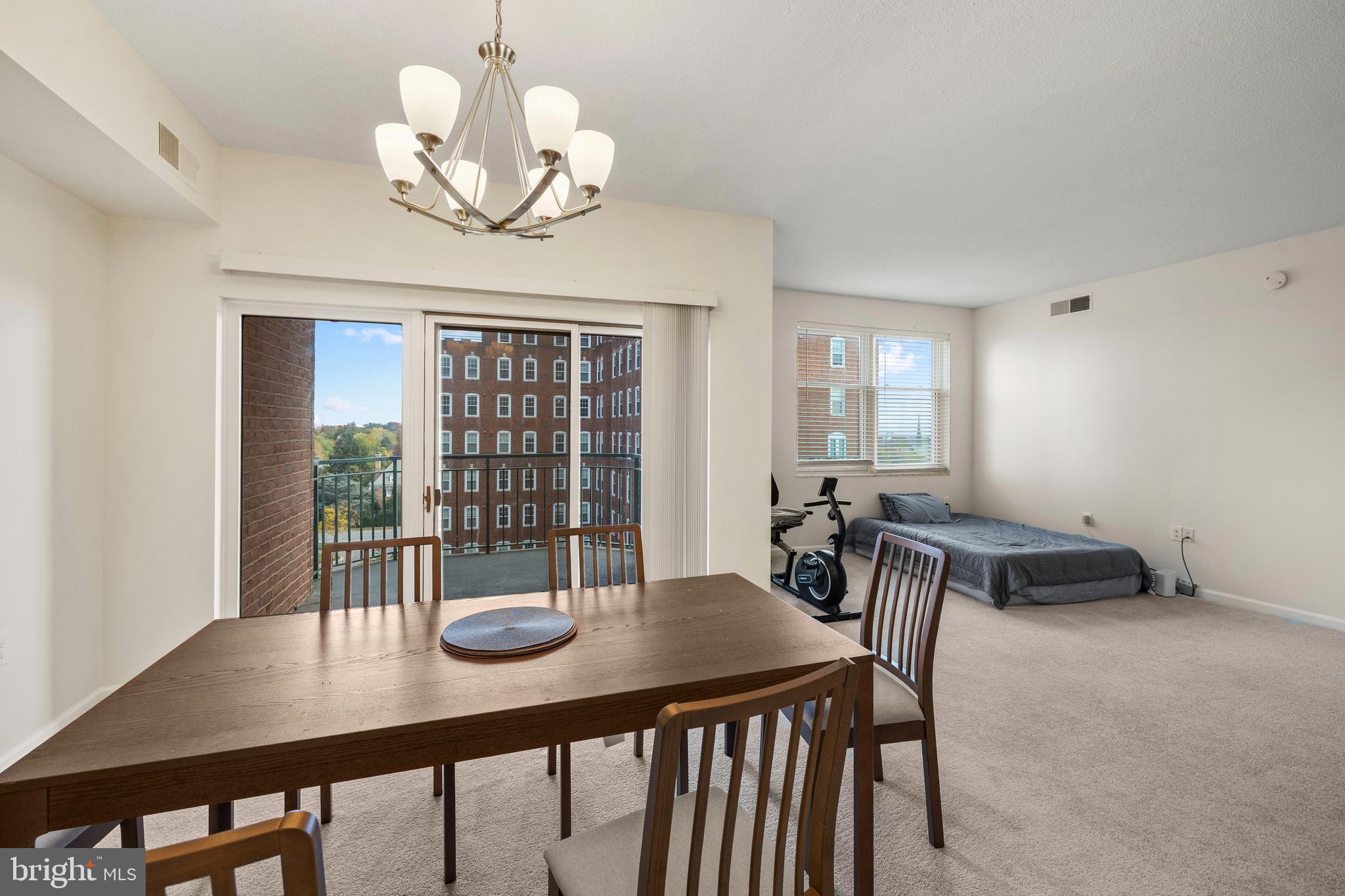 3801 Canterbury Road, Unit 708 Baltimore, MD 21218 - Photo 13 of 22 Dining area with doors to balcony
