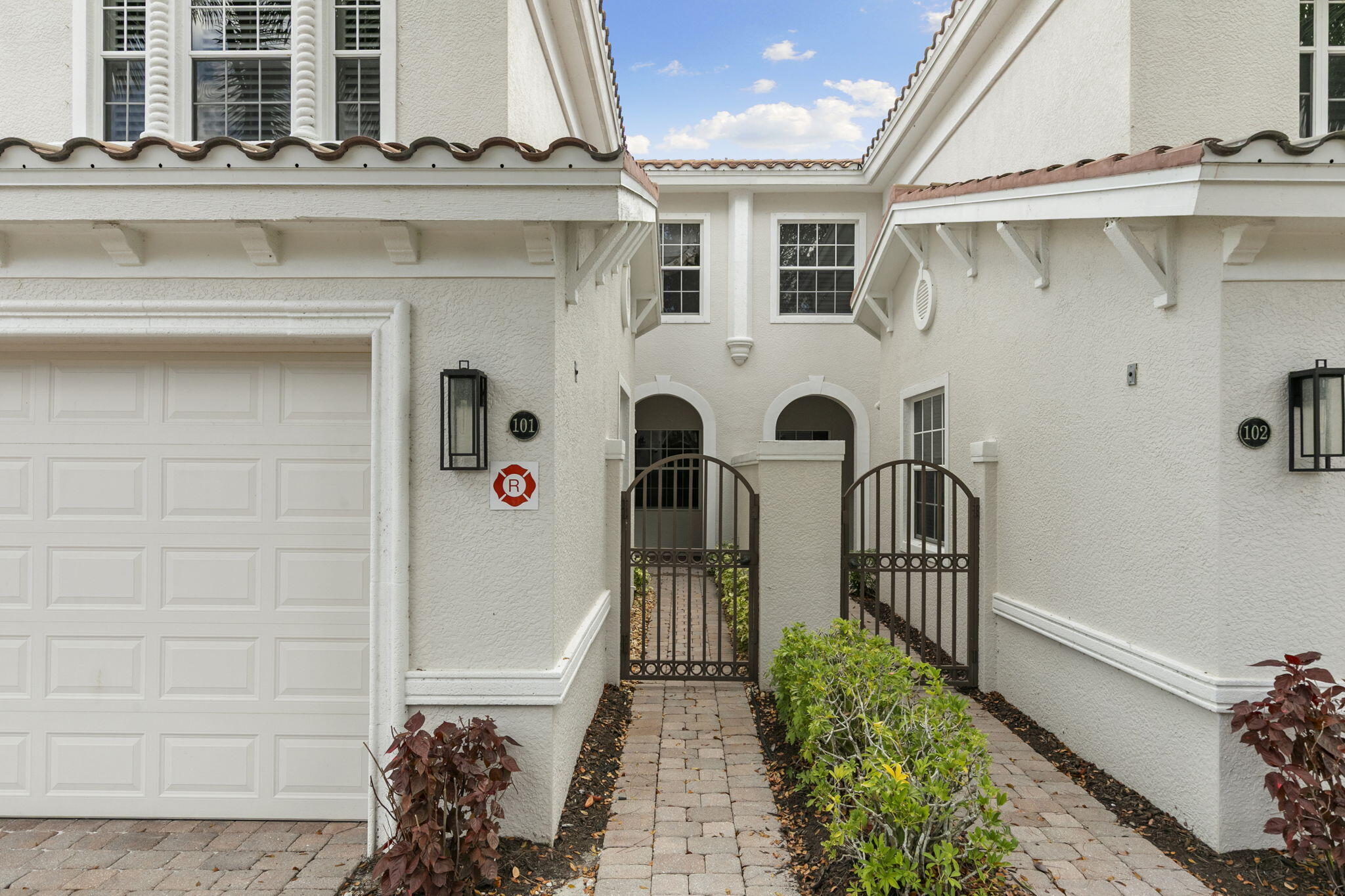 9066 Cascada Way, Unit 101 Naples, FL 34114 - Photo 4 of 51 a view of a front door and small yard