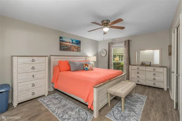 a bedroom with a bed and a dresser
