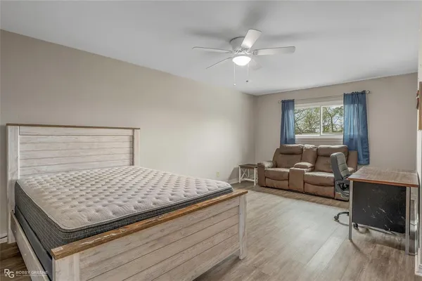 a bedroom with a bed and window