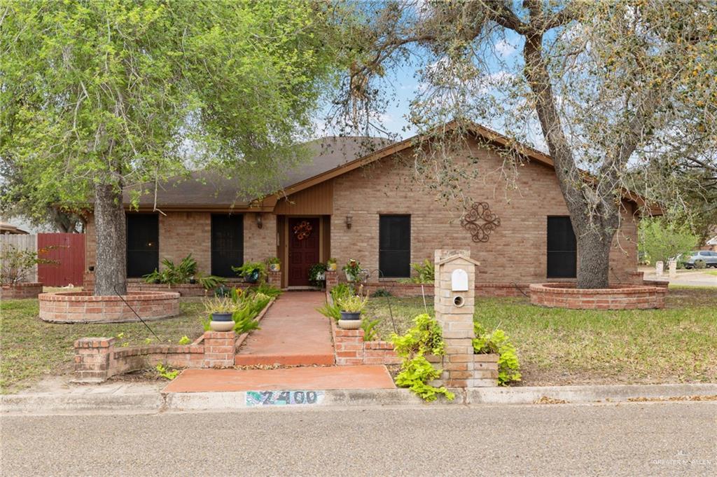 2400 Live Oak Street Mission, TX 78574 - Photo 1 of 1 a front view of house with yard and trees around