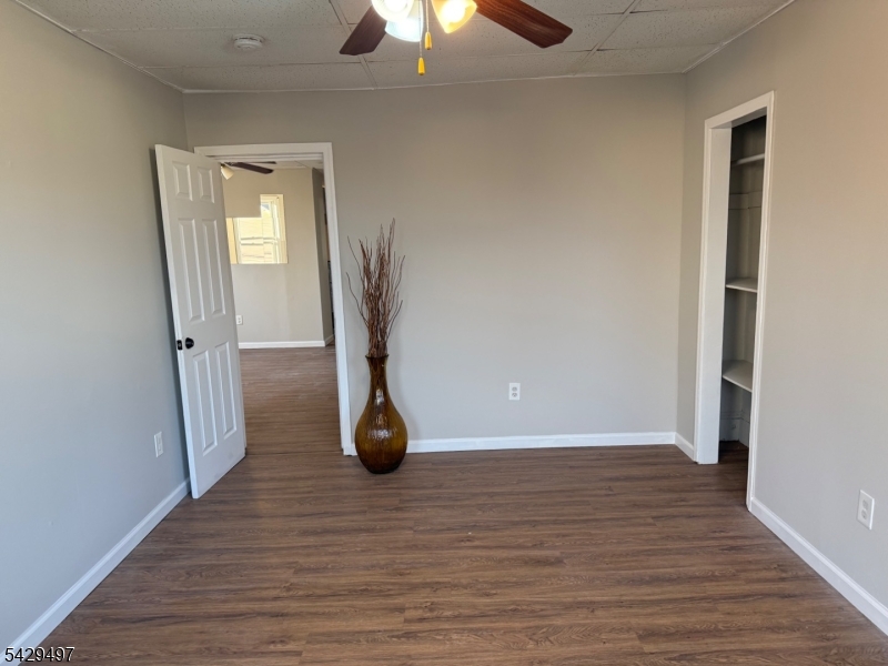 85 Holsman Street Paterson, NJ 07522 - Photo 2 of 20 a view of a room with wooden floor and chandelier