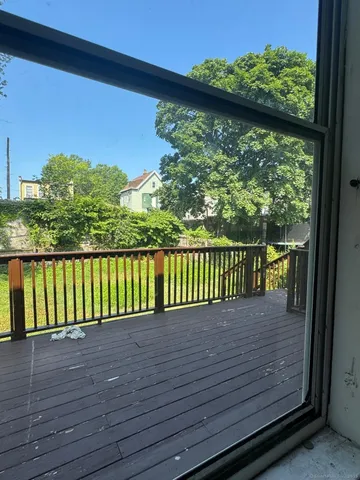 a view of an empty room with windows