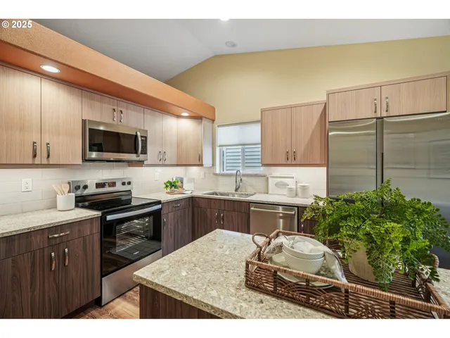 a kitchen with a sink stove and microwave