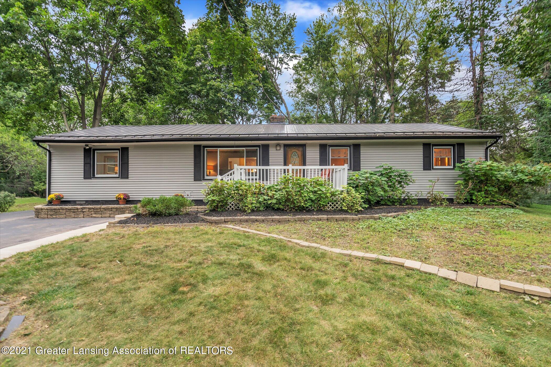 2821 North Aurelius Road Lansing, MI 48910 - Photo 3 of 48 03-2821 Aurelius Rd-Windowstill-Real-Est