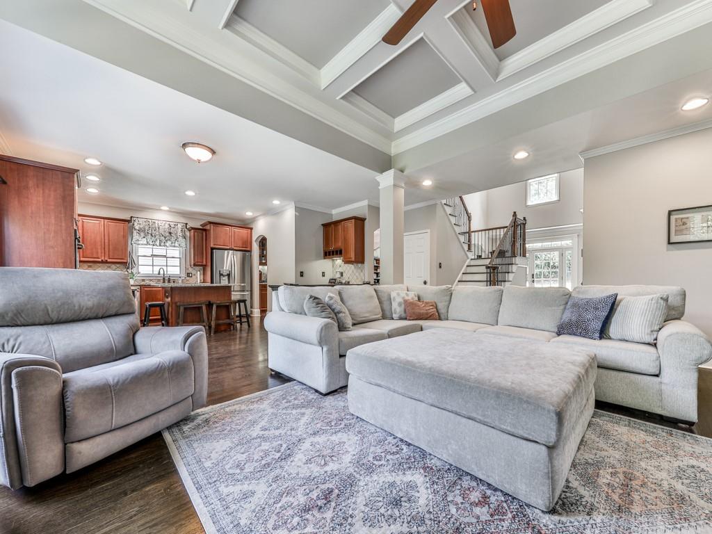 619 Riverbend Way Canton, GA 30114 - Photo 15 of 76 a living room with furniture and a view of kitchen