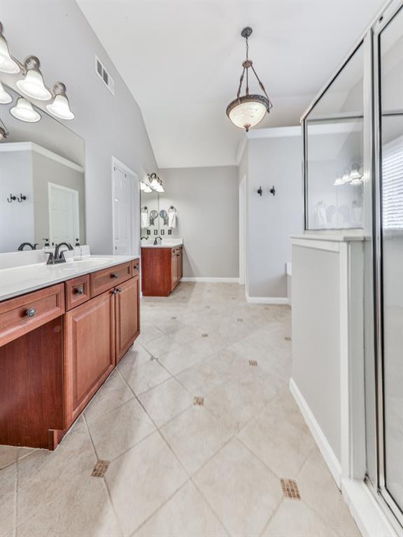 619 Riverbend Way Canton, GA 30114 - Photo 30 of 76 a large bathroom with a double vanity sink and mirror