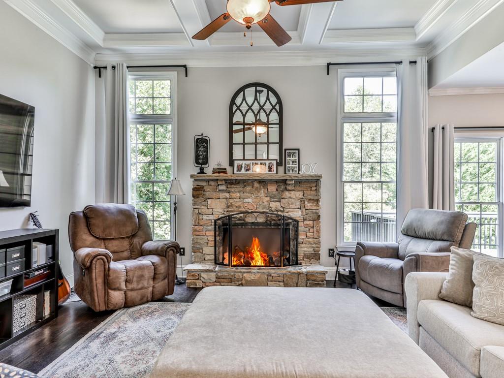 619 Riverbend Way Canton, GA 30114 - Photo 3 of 76 a living room with furniture and a fireplace