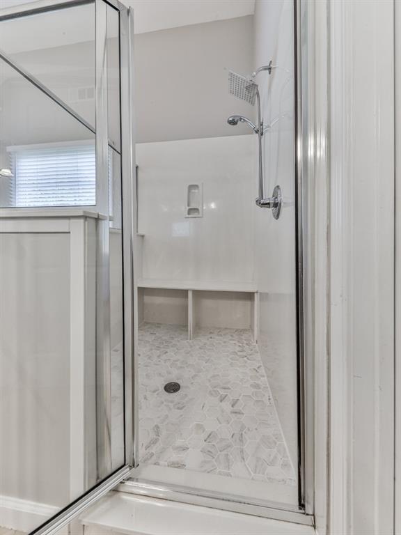 619 Riverbend Way Canton, GA 30114 - Photo 32 of 76 a bathroom with a glass shower door