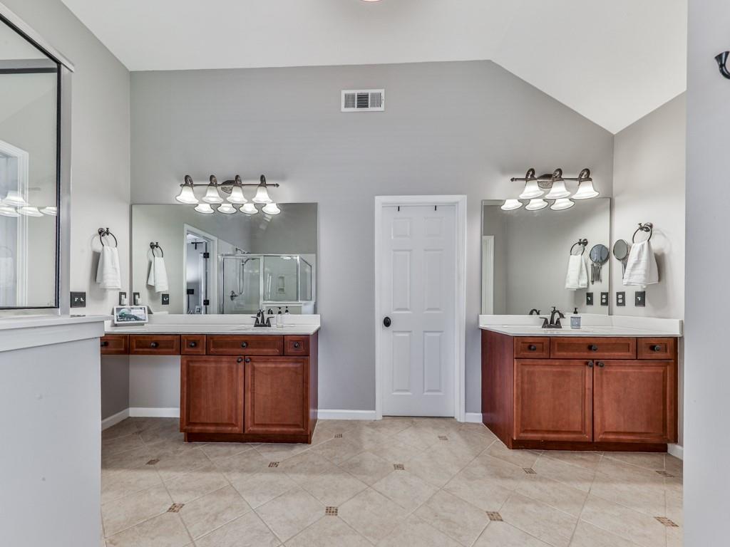 619 Riverbend Way Canton, GA 30114 - Photo 33 of 76 a large white kitchen with a sink and chandelier