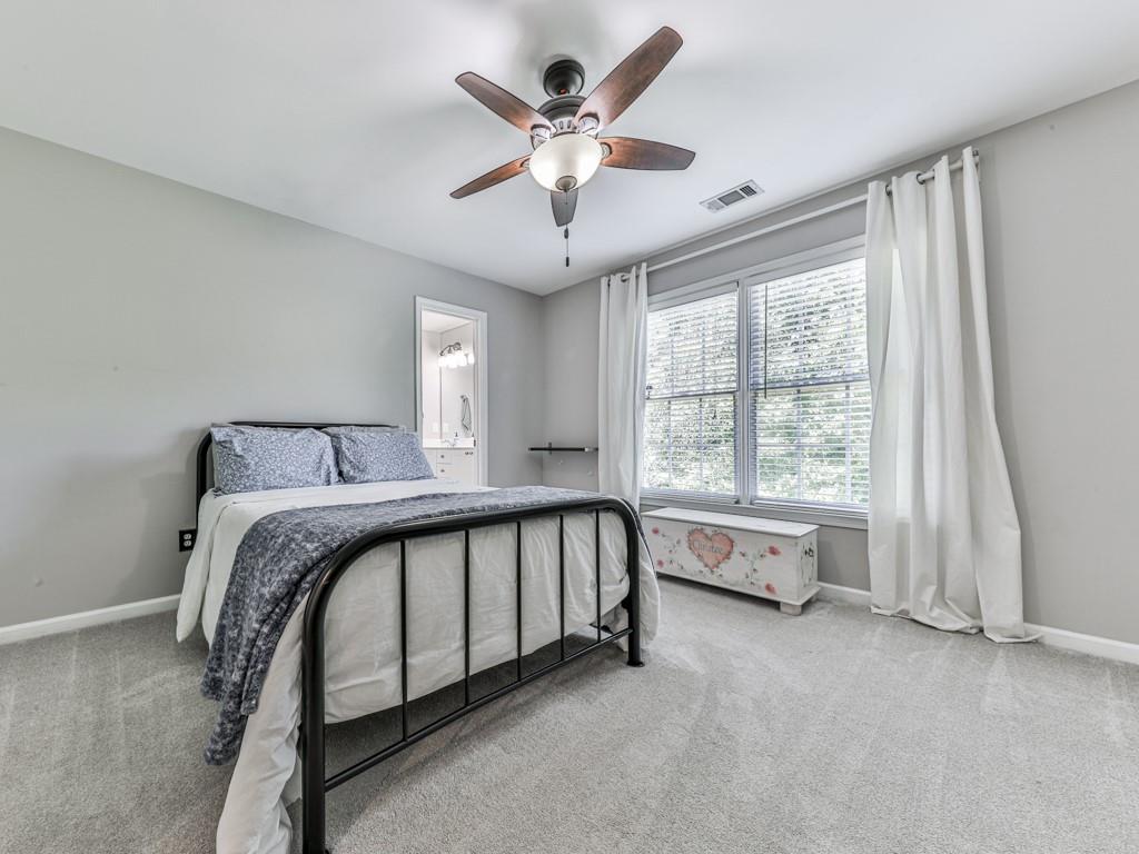 619 Riverbend Way Canton, GA 30114 - Photo 38 of 76 a spacious bedroom with a bed and a large window