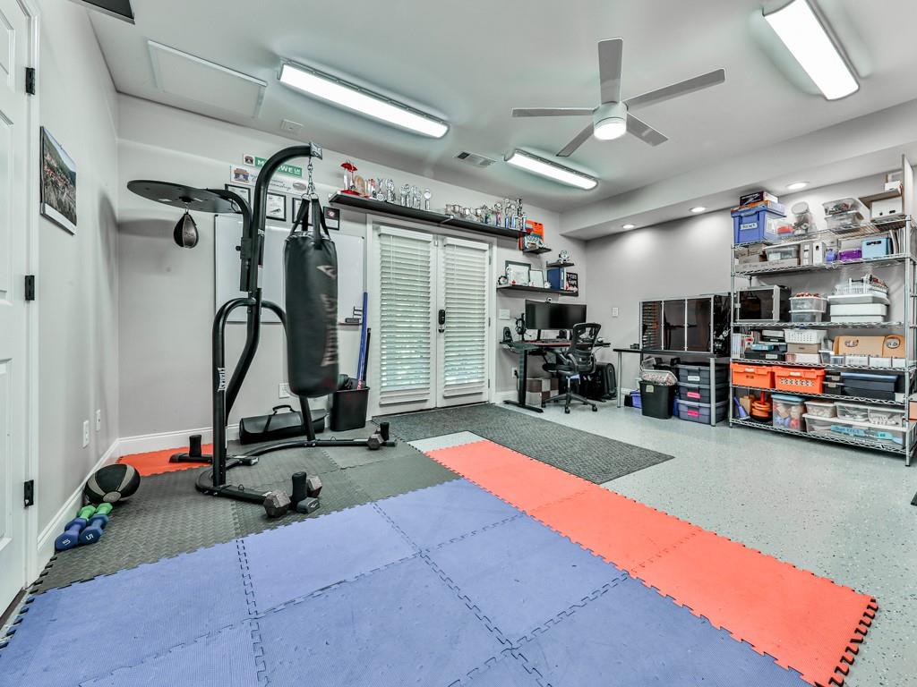 619 Riverbend Way Canton, GA 30114 - Photo 51 of 76 a view of a room with gym equipment