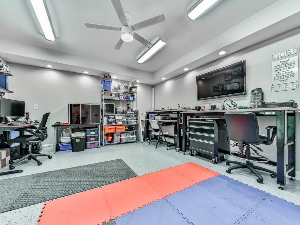 619 Riverbend Way Canton, GA 30114 - Photo 52 of 76 a room with furniture and a flat screen tv