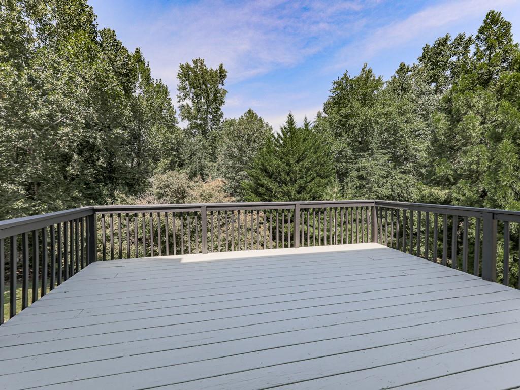619 Riverbend Way Canton, GA 30114 - Photo 53 of 76 a balcony with trees in front of it