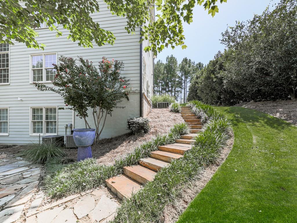 619 Riverbend Way Canton, GA 30114 - Photo 58 of 76 a front view of a house with garden