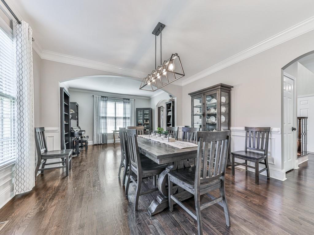 619 Riverbend Way Canton, GA 30114 - Photo 6 of 76 a view of a dining room with furniture window and wooden floor