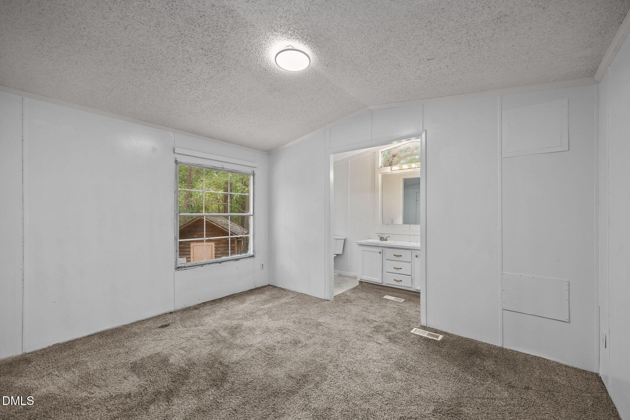6933 Big Woods Road Graham, NC 27253 - Photo 17 of 32 an empty room with windows