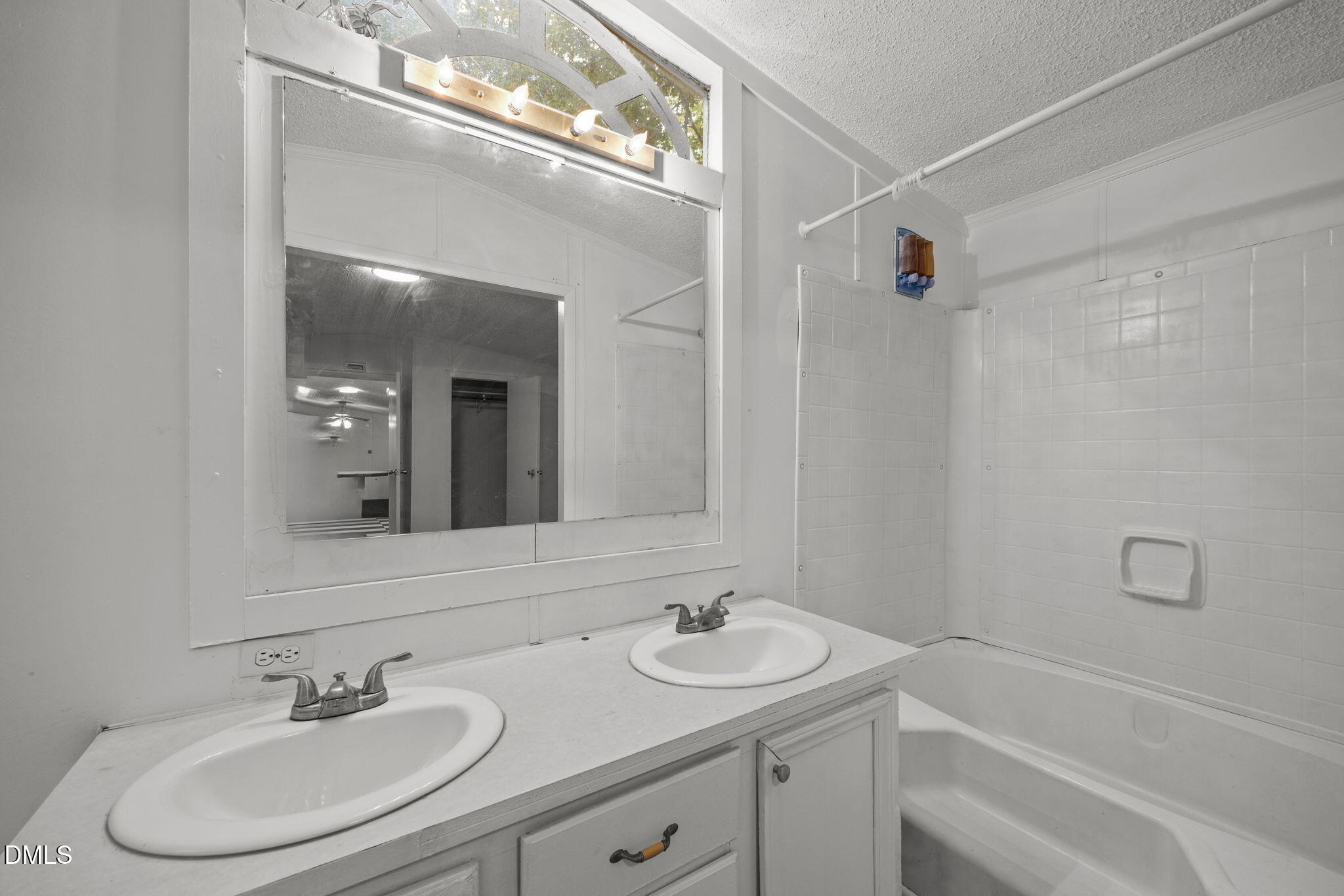 6933 Big Woods Road Graham, NC 27253 - Photo 20 of 32 a bathroom with a sink and a mirror