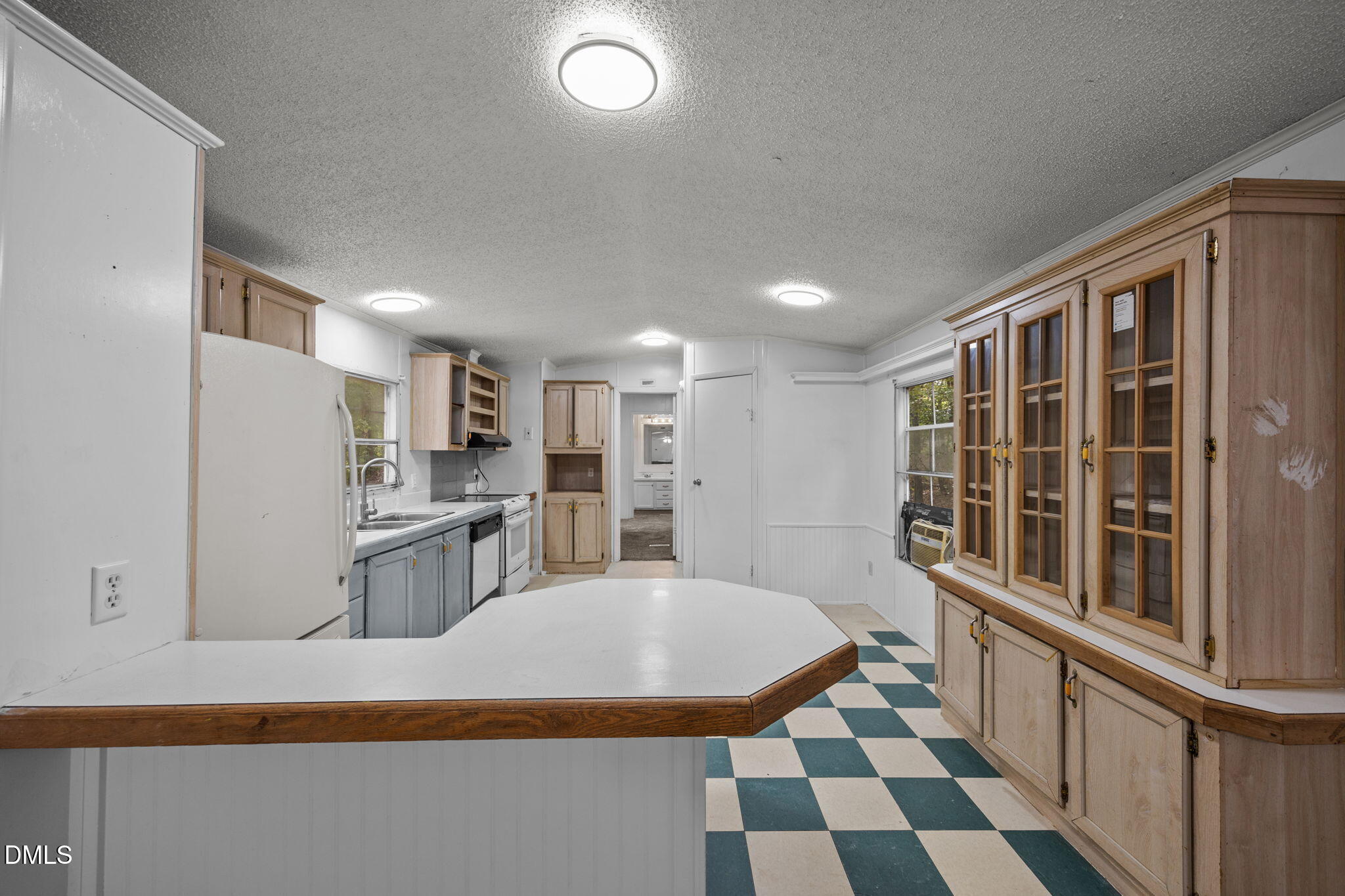 6933 Big Woods Road Graham, NC 27253 - Photo 10 of 32 a kitchen with stainless steel appliances a refrigerator and microwave