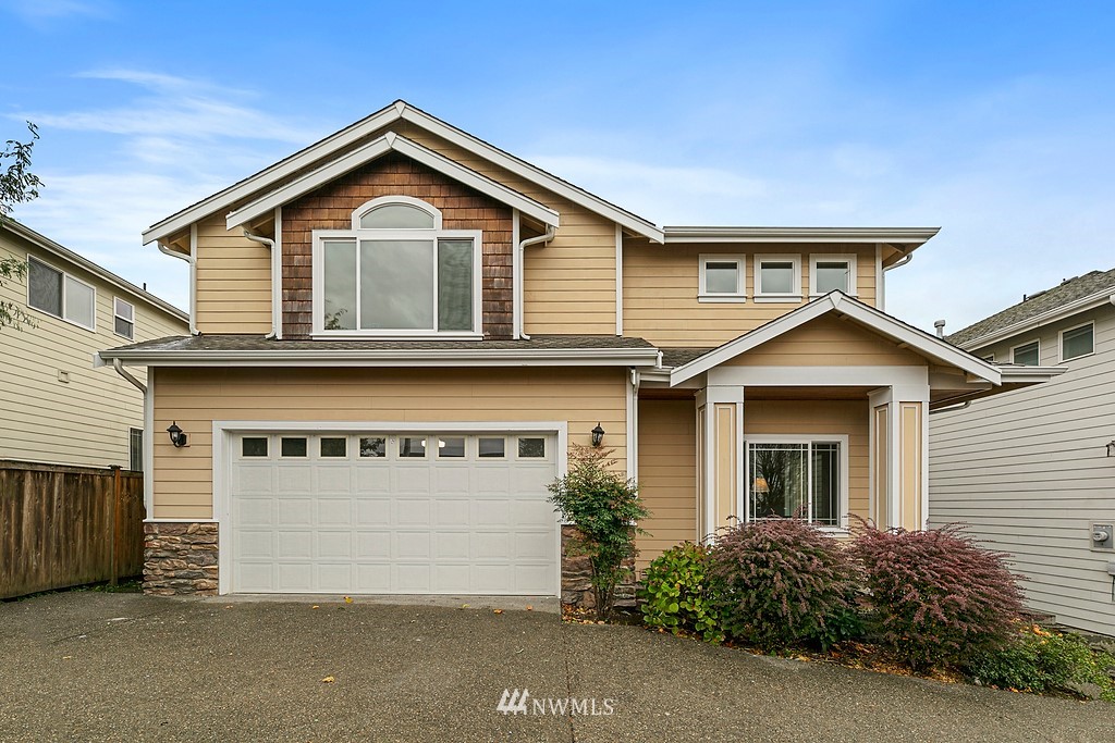 2222 Smithers Avenue South Renton, WA 98055 - Photo 1 of 25 a front view of a house with a garage