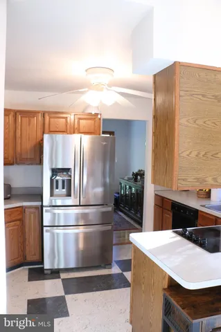 a kitchen with granite countertop a sink cabinets and window