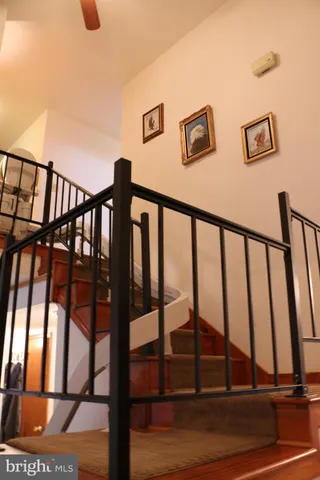 a bedroom with a bed and large windows