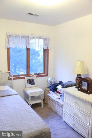 a en suite bathroom with a shower and a sink