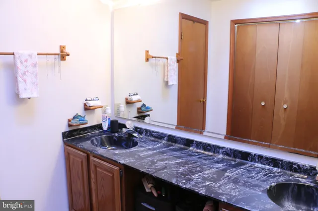 a view of room with stairs and wooden floor