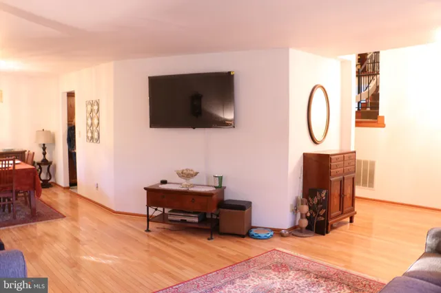 a living room with furniture or couch and a large window