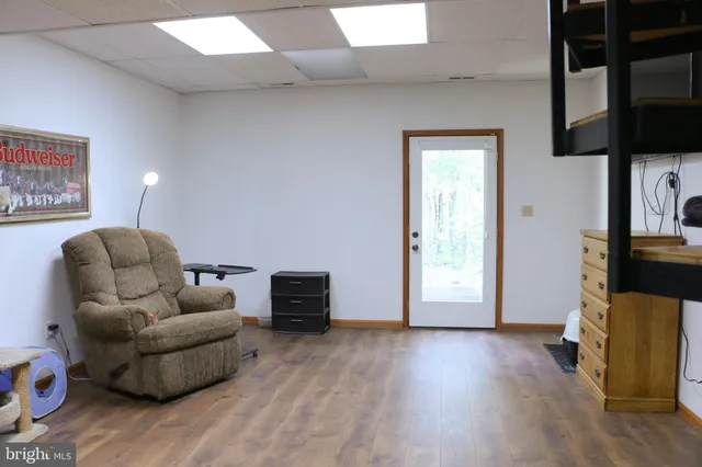 a view of balcony with wooden floor and fence