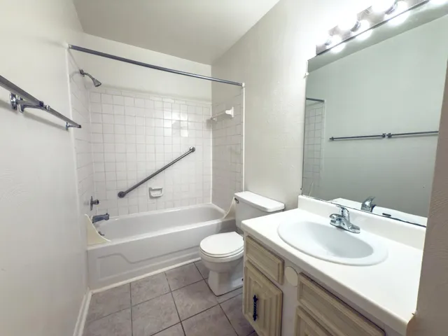 a bathroom with a sink a toilet and a bathtub