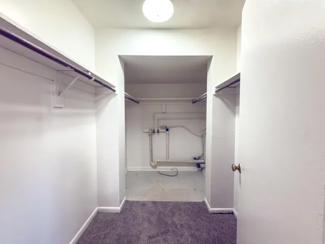 a bathroom with a toilet a sink and a mirror