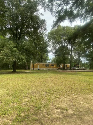 a view of swimming pool with trees
