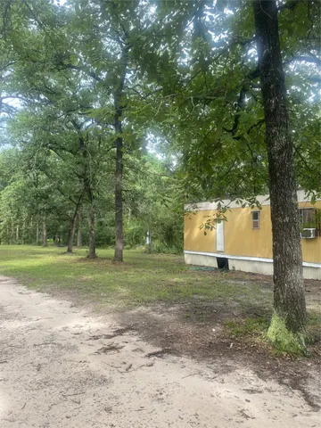 a fire hydrant in the middle of a field