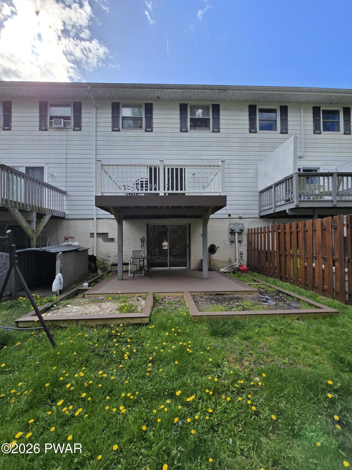 107 Keystone Hls Road, Unit 404 Factoryville, PA 18419 - Photo 8 of 23 a view of a house with backyard and sitting area