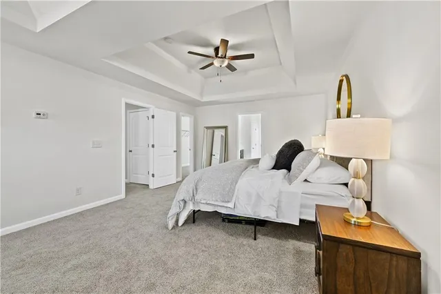 a bed room with a bed and a chandelier