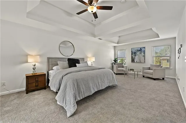 a bed room with bed and a chandelier