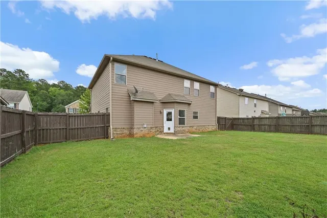 a view of a backyard with a small cabin