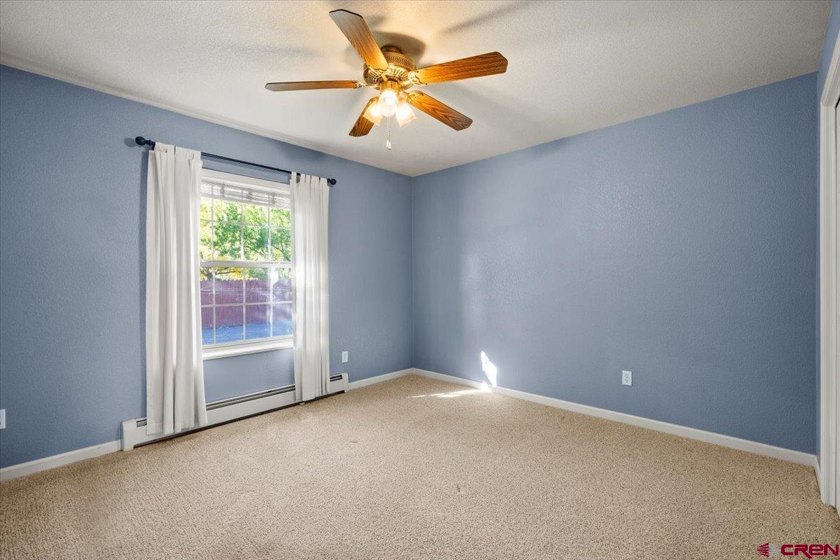 1600 Arland Road Montrose, CO 81401 - Photo 17 of 26 an empty room with a window