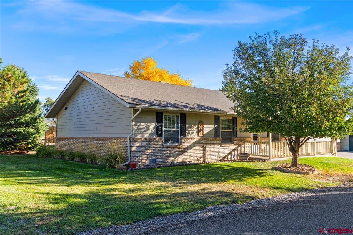 1600 Arland Road Montrose, CO 81401 - Photo 2 of 26 a view of a backyard with a slide