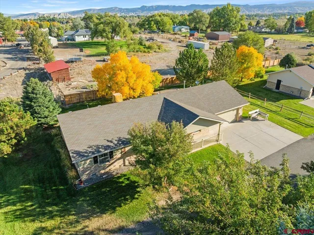 an aerial view of a house with lake view
