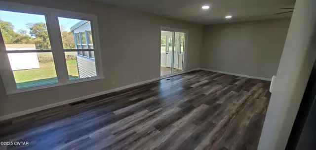 a view of an empty room and window
