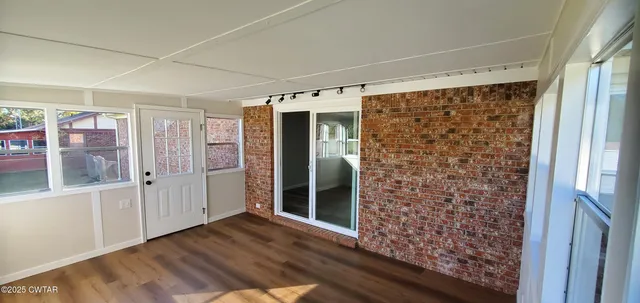 a view of entryway with wooden floor