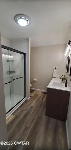 a room with a mirror and vanity