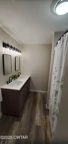 a bathroom with a sink and mirror