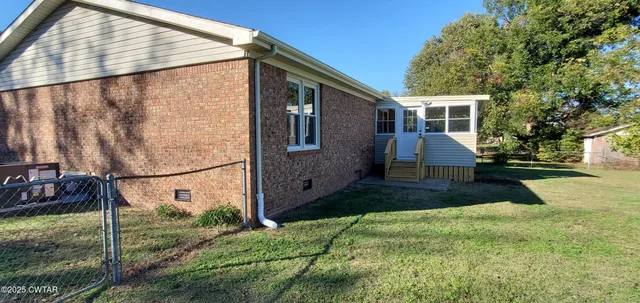 a backyard of a house with seating space