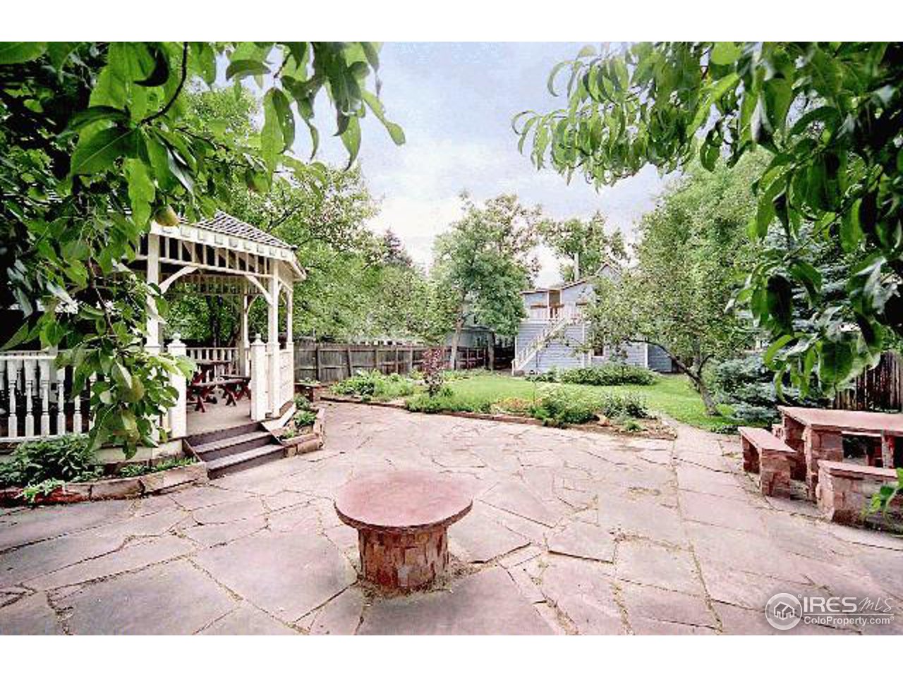 2021 Mapleton Avenue Boulder, CO 80304 - Photo 3 of 7 a view of a patio with a table and chairs