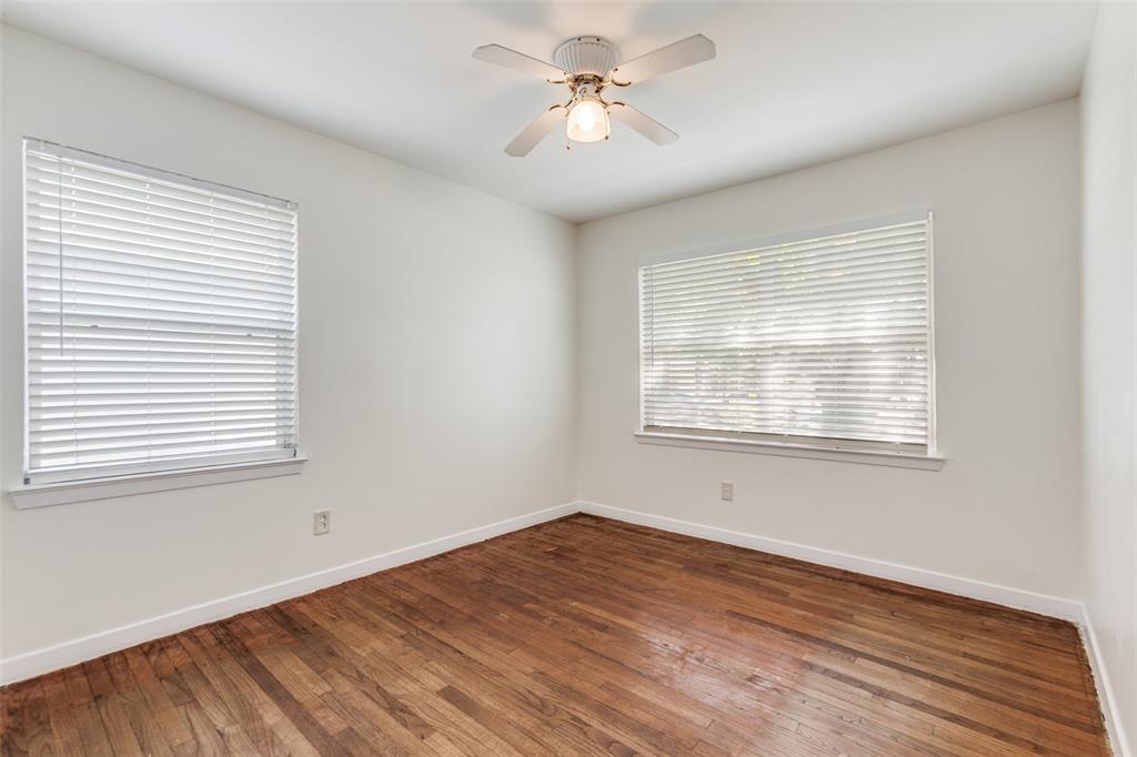 10815 Ruth Ann Drive Dallas, TX 75228 - Photo 8 of 12 a view of a room with wooden floor and a window