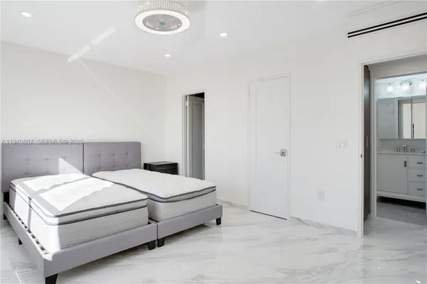 a bedroom with a bed and a view