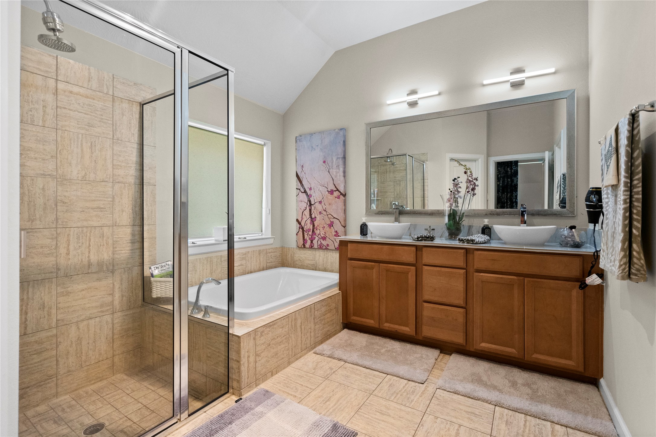 31503 Reston Cliff Court Spring, TX 77386 - Photo 16 of 28 a bathroom with a tub sink shower and mirror